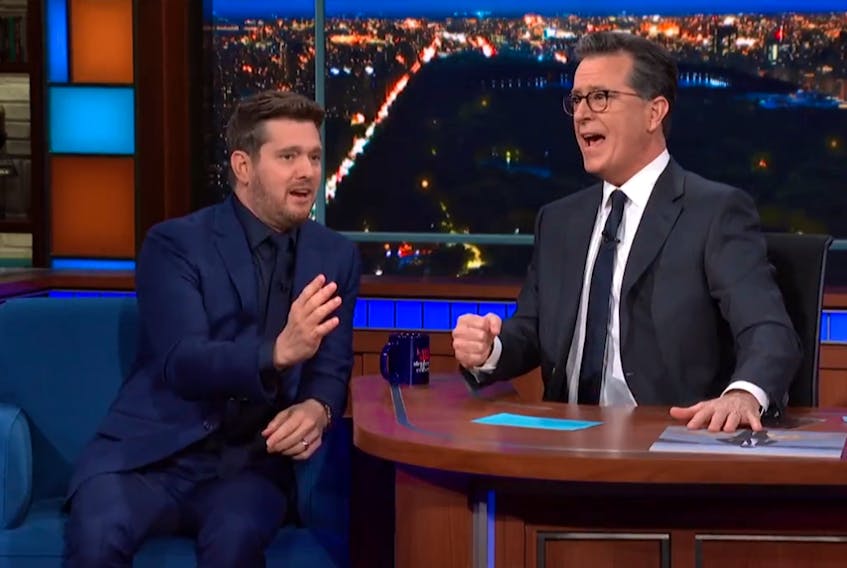 Michael Buble, left, sings Stan Rogers’ Barrett’s Privateers with Stephen Colbert on the Late Night with Stephen Colbert on Wednesday, March 16, 2022.