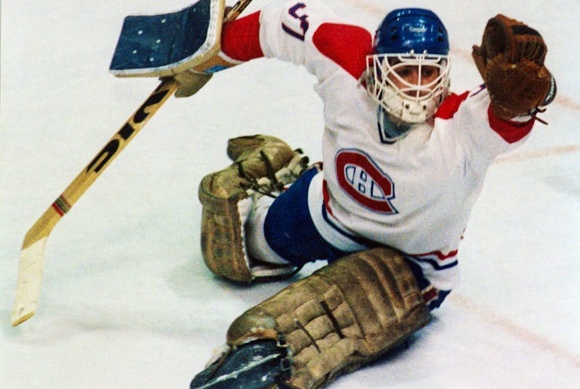 Canadiens goalie Steve Penney reaches out for the glove save in his 4-2 playoff win over the New York Islanders in Montreal on April 26,  1984.  