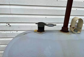 One of the oil tanks outside the Port Morien Volunteer Fire Department. The open cap was one of the first clues the oil in the tank was stolen. CONTRIBUTED 