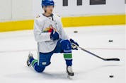  Vancouver Canucks centre Elias Pettersson was back skating at practice Wednesday.