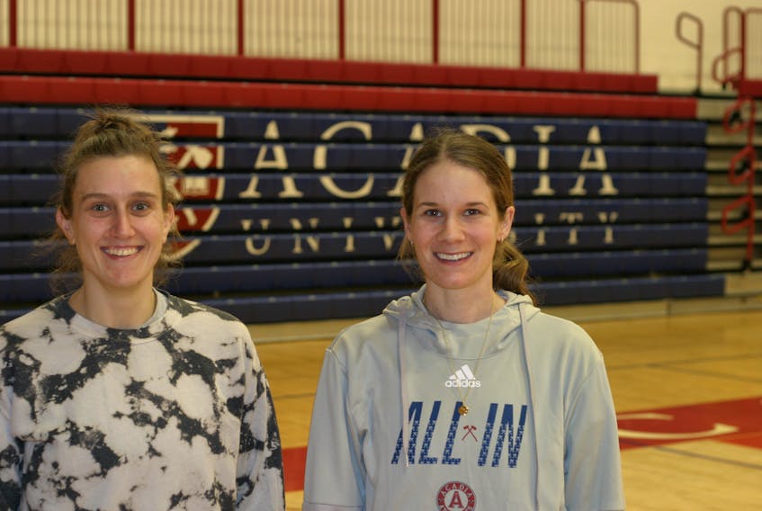 Marissa Lindquist, left, and Lindsay Harris are assistant coaches with the Acadia Axewomen basketball team.