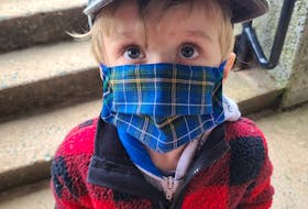 Young Vincent wears a Nova Scotia tartan mask on the way to the grocery store. CONTRIBUTED