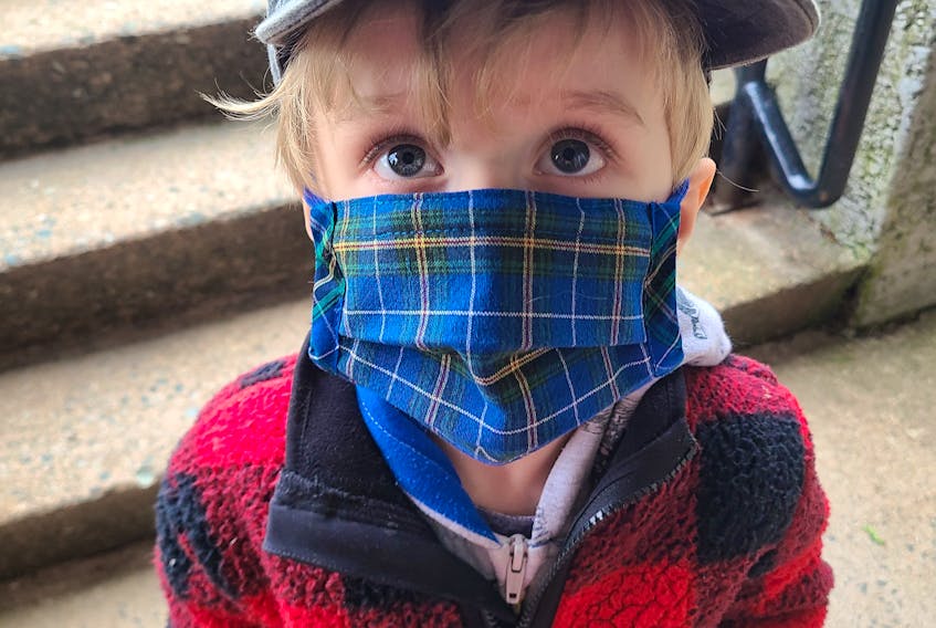 Young Vincent wears a Nova Scotia tartan mask on the way to the grocery store. CONTRIBUTED