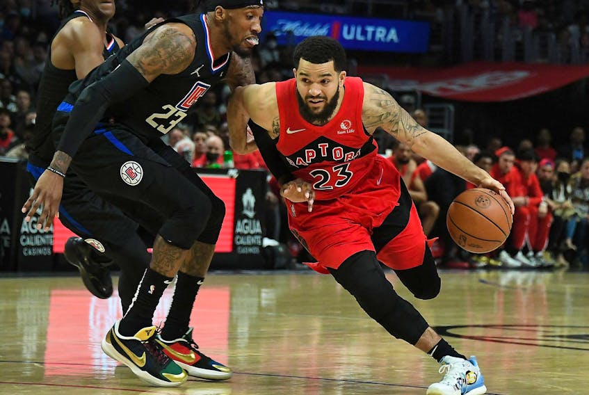 Raptors guard Fred VanVleet (23) moves to the basket against Los Angeles Clippers forward Robert Covington (23) on Wednesday. 

