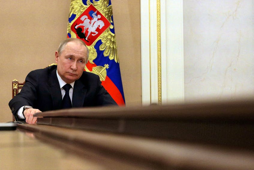 Russian President Vladimir Putin attends a meeting with government members via a video link in Moscow earlier this month. Documents seized by Ukrainian troops on March 2 suggest that Russie expected the military phase of the invasion to be completed within 15 days. - Sputnik/Mikhail Klimentyev/Kremlin via REUTERS