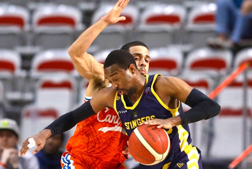 The Edmonton Stingers’ Jahmal Jones battles the Cangrejeros’ Angel Rodriguez during their Basketball Champions League Americas game at WinSport’s Markin MacPhail Centre in Calgary on Monday, March 14, 2022. 