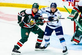Halifax Mooseheads defenceman Alexandre Tessier, left, and Sherbrooke Phoenix captain Xavier Parent battle in front of the Halifax net during Saturday's QMJHL game in Sherbrooke, Que. - Vincent Levesque Rousseau/Sherbrooke Phoenix