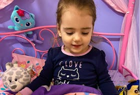 Madison Mehaney, immersed in the Little Blue Chair, is one of the young readers enjoying the Dolly Parton Imagination Library program in Newfoundland and Labrador. CONTRIBUTED