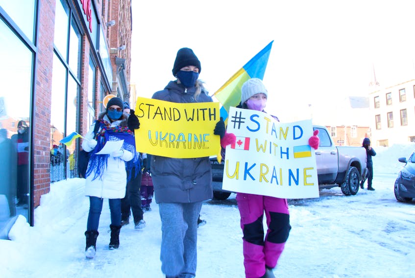 Demonstrators in front of Charlottetown City Hall on Feb. 6.  display signs showing support for Ukraine amid Russia's invasion of the country. File Photo

