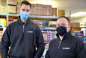 Jamie Holland, left, and Luke Beck, right, took over Kays Wholesale in December 2021. Beck says despite brainstorming ideas on how to grow and expand the business, their focus is on learning the business and keeping things running as smoothly as they have been.