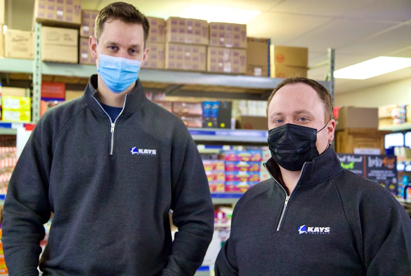 Jamie Holland, left, and Luke Beck, right, took over Kays Wholesale in December 2021. Beck says despite brainstorming ideas on how to grow and expand the business, their focus is on learning the business and keeping things running as smoothly as they have been.