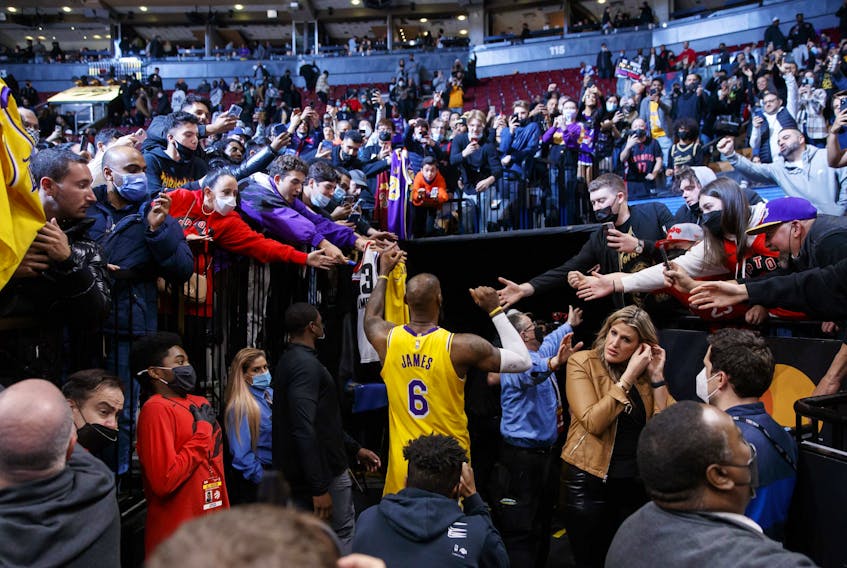 LeBron James of the Los Angeles Lakers leaves the court following their NBA game victory against the Toronto Raptors at Scotiabank Arena on March 18, 2022 in Toronto.
