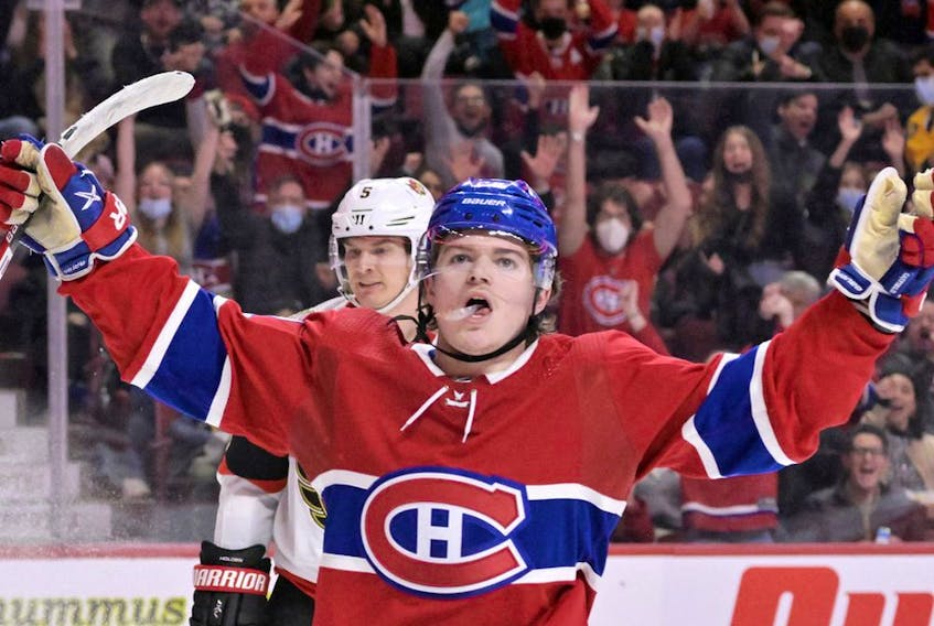 Canadiens' Cole Caufield celebrates after scoring a goal against the Ottawa Senators during the second period at the Bell Centre on Saturday, March 19, 2022, in Montreal. 