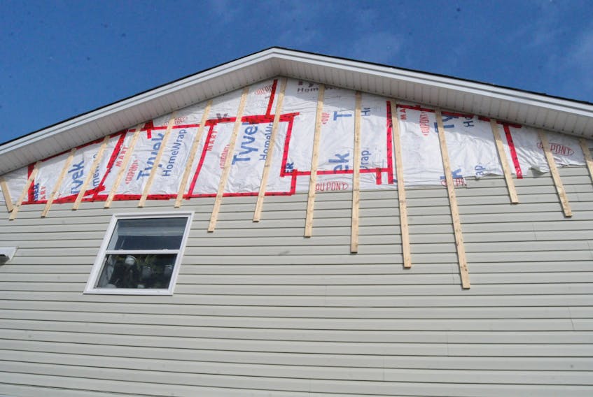Ryan Cooke’s house has a temporary fix with strapping to prevent further wind damage to the siding while he awaits contractors to finish the work. -Joe Gibbons/SaltWire Network