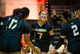 Dalhousie Tigers captain Julie Moore (7) leads her team into the U Sports women's volleyball championship that begins on Friday in Calgary. Trevor MacMillan