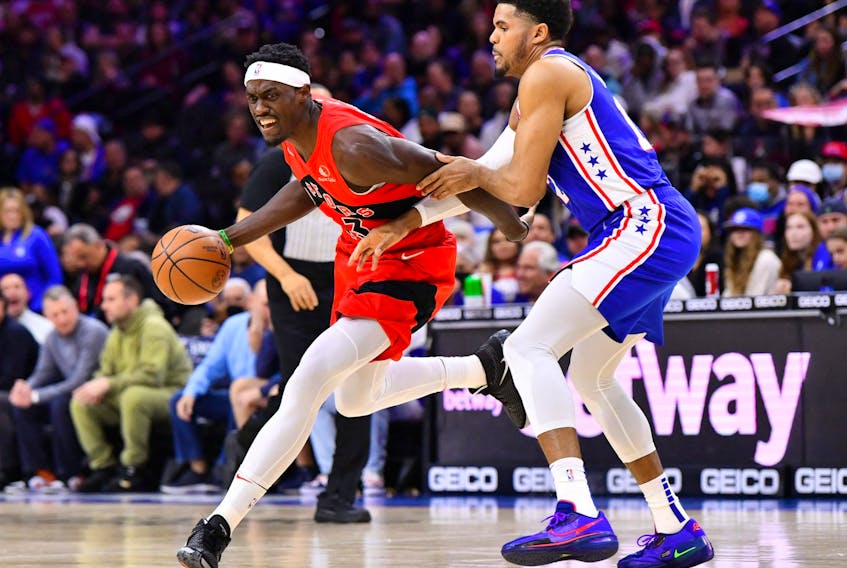  Toronto Raptors forward Pascal Siakam drives with the ball against Philadelphia 76ers forward Tobias Harris in the first quarter at Wells Fargo Center in Philadelphia, Pa., March 20, 2022.