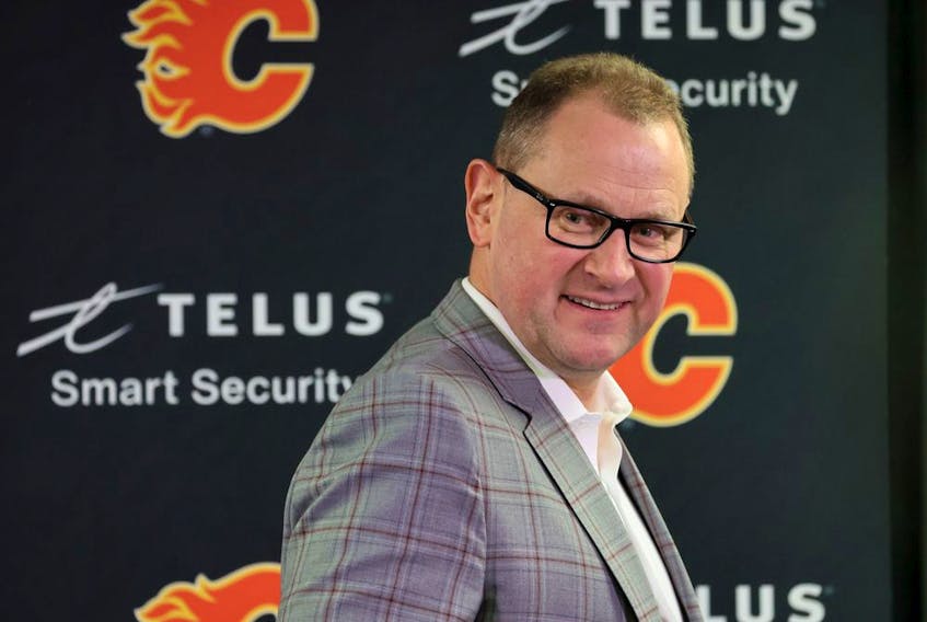 Calgary Flames general manager Brad Treliving smiles after speaking to media at the Scotiabank Saddledome on NHL trade deadline day, Monday, March 21, 2022. 