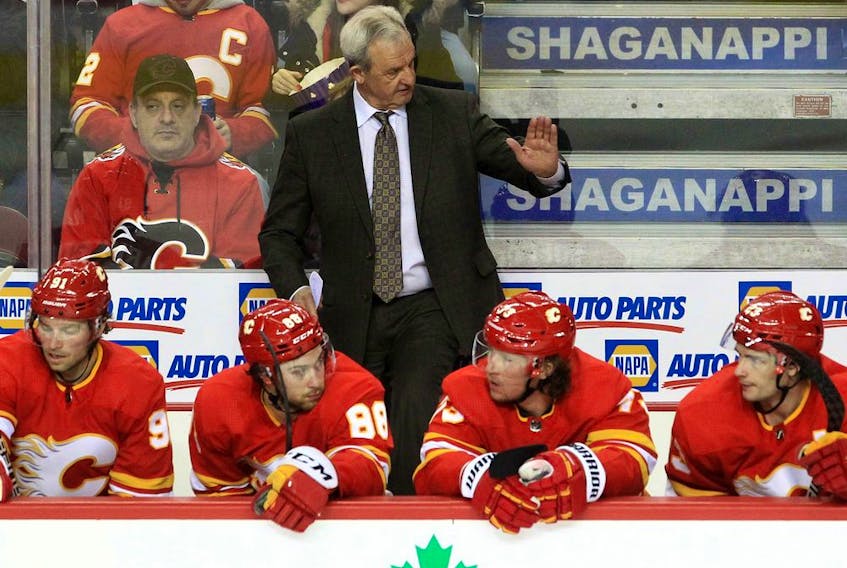  Calgary Flames head coach Darryl Sutter gestures during a game against the Buffalo Sabres at Scotiabank Saddledome in Calgary on Friday, March 18, 2022.