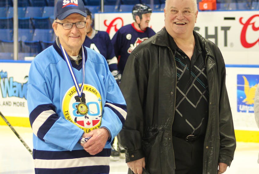 Mike Campbell of Victoria Mines shares a laugh with Kevin Morrison, right a former NHL, WHA and AHL defenceman from Sydney, to honour Campbell’s induction into the 80+ Hockey Hall of Fame at Centre 200 on Sunday. The 80+ Hockey Hall of Fame is a not-for-profit organization which formally recognizes active hockey players across the country who are aged 80 years and over. Campbell, now 96, has played recreational hockey for more than 80 years — 52 years between the Centennial Arena and Cape Breton County Recreation Centre, along with 30 years at the New Waterford and District Community Centre — until the longtime defenceman decided to finally hang up his skates at the end of 2019. IAN NATHANSON • CAPE BRETON POST