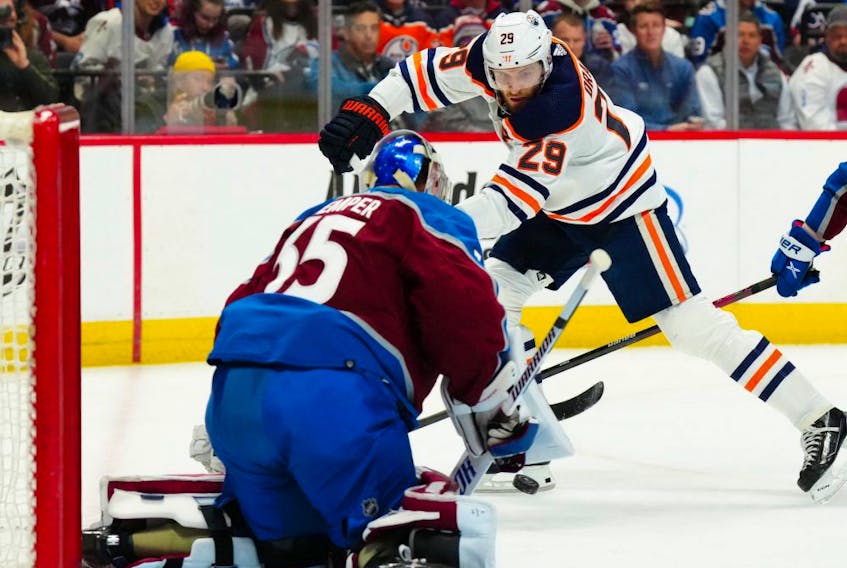 Edmonton Oilers center Leon Draisaitl (29) shoots the puck at Colorado Avalanche goaltender Darcy Kuemper (35) at Ball Arena on Mar 21, 2022.