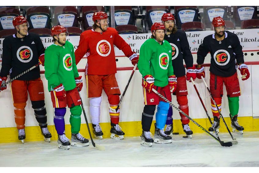 Calgary Flames players skated with multicoloured socks in honour of World Down Syndrome Day during practise at the Scotiabank Saddledome, Monday, March 21, 2022. 

