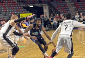 Dartmouth, N.S., native Terry Thomas will head to St. John’s this summer as the latest signing of the Newfoundland Growlers basketball club. Thomas (middle) is shown here with the Halifax Hurricanes in the National Basketball League of Canada. 