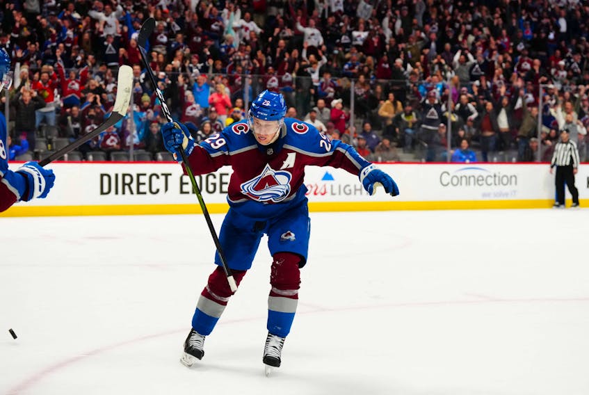 Colorado Avalanche centre Nathan MacKinnon (29) celebrates his overtime goal against the Edmonton Oilers at Ball Arena in Denver, Colo., on Monday, March 21, 2022. - Ron Chenoy / USA TODAY Sports