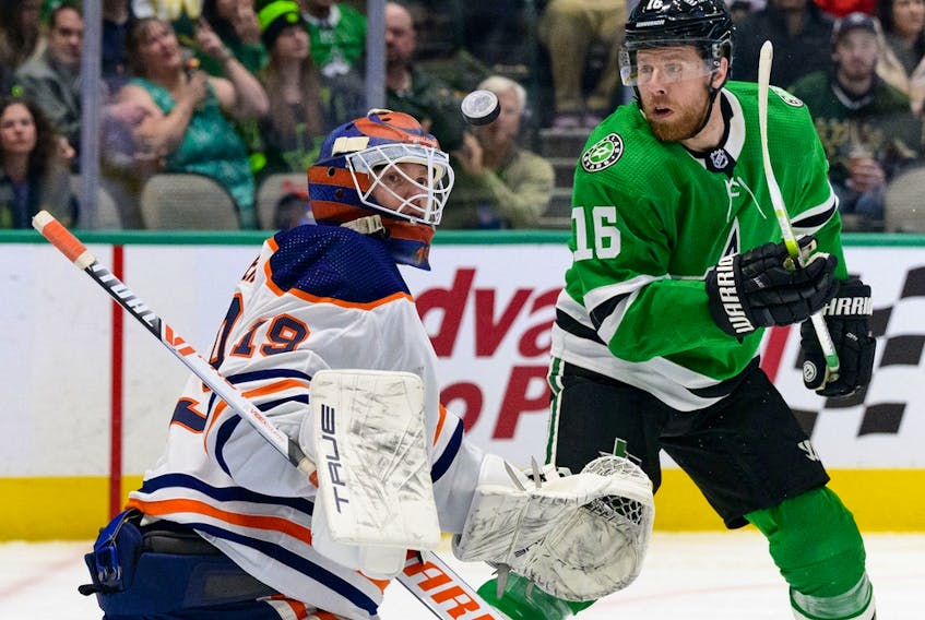 Edmonton Oilers goaltender Mikko Koskinen (19) makes a pad save as Dallas Stars center Joe Pavelski (16) looks for the rebound at American Airlines Center on Tuesday, March 22, 2022.
