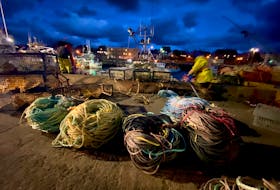 Gear is loaded onto a fishing vessel in Yarmouth, Nova Scotia, prior to the start of the 2021-2022 lobster season. The lobster fishery is one that has seen sadness and heartache in the past, but efforts continue to make it safer each year. TINA COMEAU PHOTO