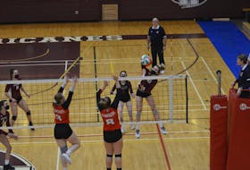 The Holland Hurricanes’ Ava Beisal, 10, drives the ball over the net in a 2021-22 Atlantic Collegiate Athletic Association (ACAA) women’s volleyball match against the UNBSJ Seawolves at the McMillan Centre for Community Engagement in Charlottetown.