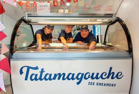 Daniel Curren (right) is joined by Tatamagouche Ice Creamery Scoop Store supervisors Beth Langille and Alec MacDonald in scooping up some of the company’s popular ice cream. The Tatamagouche business has been a huge success story since opening in 2020. Contributed