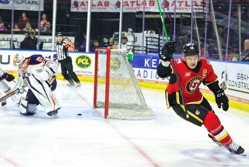 Stockton Heat captain Byron Froese celebrates a goal against the Bakersfield Condors. Froese recently notched an impressive milestone -- 500 career appearances at either the NHL or AHL level.