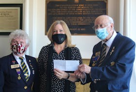 Gayle Mueller, first vice president of The George R. Pearkes V.C. Branch #5 Royal Canadian Legion in Summerside, left, and Legion president Jim Steele, right, present a $3,000 cheque to Heather Matheson with the Prince County Hospital foundation.