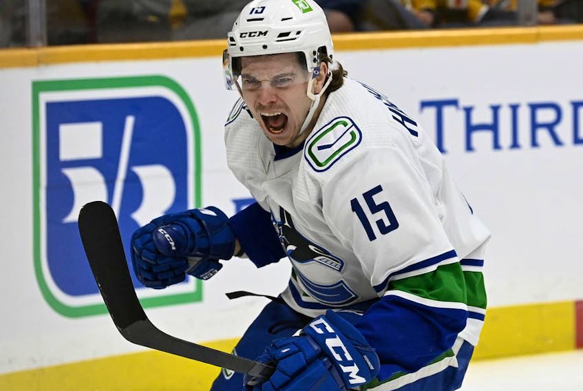Vancouver Canucks centre Matthew Highmore (15) celebrates after scoring a goal against the Nashville Predators during the first period of an NHL hockey game Tuesday, Feb. 1, 2022, in Nashville, Tenn.