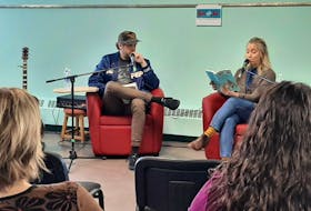 Michael S. Ryan of the band The Town Heroes and his wife and travel partner, artist Kristen Harrington, were at the Sydney branch of the Cape Breton Regional Library on Saturday to read from their book You and Me. ARDELLE REYNOLDS/CAPE BRETON POST