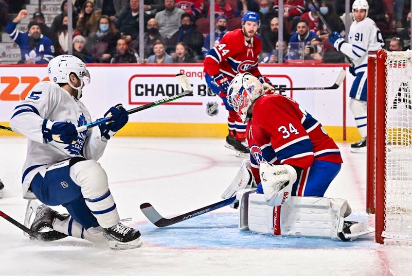 Canadiens goaltender Jake Allen makes a save on a shot by Leafs' Alexander Kerfoot during the first period at the Bell Centre on Saturday, March 26, 2022, in Montreal.