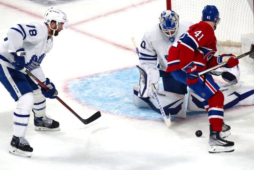 Maple Leafs goaltender Erik Kallgren makes a save against Canadiens left wing Paul Byron during second period NHL action in Montreal, Saturday, March 26, 2022.