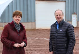 Marie-Claude Bibeau, federal minister of Agriculture and Agri-Food, left, speaks with Egmont MP Bobby Morrissey at J. and J. Farm in O'Leary. Bibeau, who visited P.E.I. farmers on March 26, says Island seed potatoes will not flow to U.S. markets until a CFIA investigation is completed next year. 