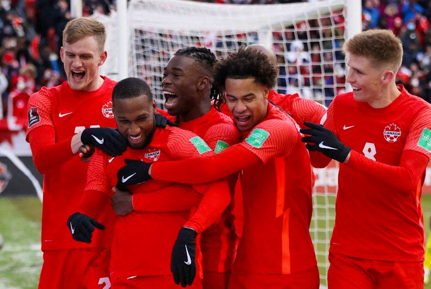 Canada's Junior Hoilett celebrates scoring their third goal over Jamaica with teammates at BMO field Toronto. Canada would go on to qualify for Qatar 2022 world cup. REUTERS/Carlos Osorio 