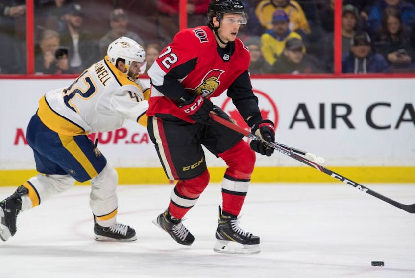 Ottawa Senators defenceman Thomas Chabot (72) skates with the puck as Nashville Predators centre Colin Blackwell (42) defends in the first period at the Canadian Tire Centre, Dec. 19, 2019.