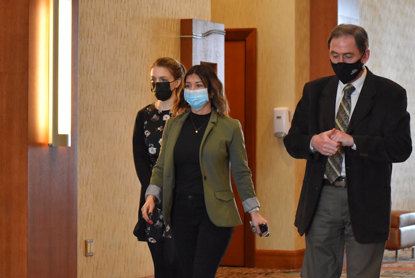 Attorney Melissa Trowsdale, left, Melissa MacDonald with the College of Physicians and Surgeons and attorney Doug Drysdale arrive at a hearing in Charlottetown on March 30. The hearing is looking into allegations of misconduct against a P.E.I. psychiatrist.  