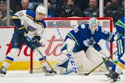  Vancouver Canucks goalie Thatcher Demko (35) prepares to make a save as St. Louis Blues forward Brayden Schenn (10) looks for the rebound in the first period at Rogers Arena.