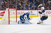  St. Louis Blues forward Robert Thomas (18) scores a goal past Vancouver Canucks goalie Thatcher Demko (35) in the second period at Rogers Arena.