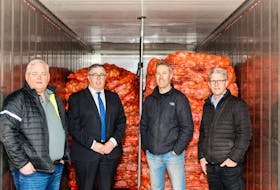 Scott Annear, left, general manager of Morley Annear, Environment Minister Steven Myers, Ryan McKenna, owner of McKenna Bros, and Greg Donald, P.E.I. Potato Board general manager, met at McKenna Bros. in Cardigan on March 31
as a load of fresh potatoes was prepped to leave the Island for Puerto Rico’s food banks. 