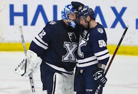 St. FX  X-Men  goalie Joseph Raymaker is congratulated by teammate Santino Centorame following their 3-0 victory over the Brock Badgers following  their University Cup match in Wolfville Thursday March 31, 2022. 

TIM KROCHAK PHOTO