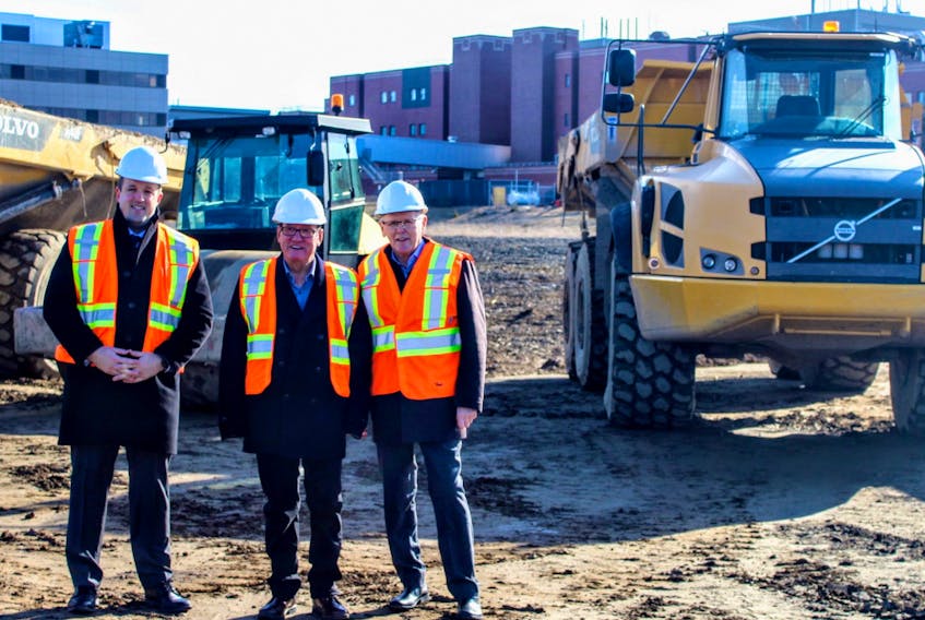 The ongoing construction behind the Cape Breton Regional Hospital includes the building of a new access road that will give motorists entering or exiting the grounds of the sprawling health care complex another option. Above, Brian Comer, Cape Breton East MLA and minister responsible for the Office of Addictions and Mental Health, Chief Terry Paul of Membertou First Nation and Dr. Elwood MacMullin, senior medical director of the Cape Breton Regional Municipality Health Care Redevelopment Project are all smiles after an agreement between the province and the First Nation community paved the way for the new road. CONTRIBUTED/NOVA SCOTIA HEALTH