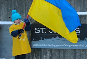 Maxim Elmelisi, 4, waves a Ukrainian flag during a late February rally in support of Ukraine at St. John’s City Hall. The province, as is the rest of Canada, is preparing to welcome people fleeing the war in Ukraine.
