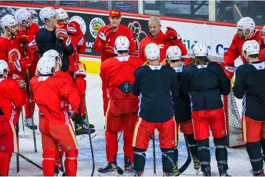 Calgary Flames head coach Darryl Sutter talks with the team during practice at Scotiabank Saddledome on Dec. 29, 2021. 