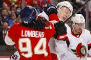  Senators captain Brady Tkachuk scuffles with Ryan Lomberg of the Panthers clash during first-period action in Sunrise, Fla., on Thursday night.