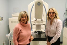 Valerie Docherty, left, chair for the QEH Foundation’s annual Friends for Life Campaign, and Dr. Kim Hender, QEH radiologist, stand by one of the hospital’s current mammography machines that will soon be replaced thanks to an outpouring of donor support.